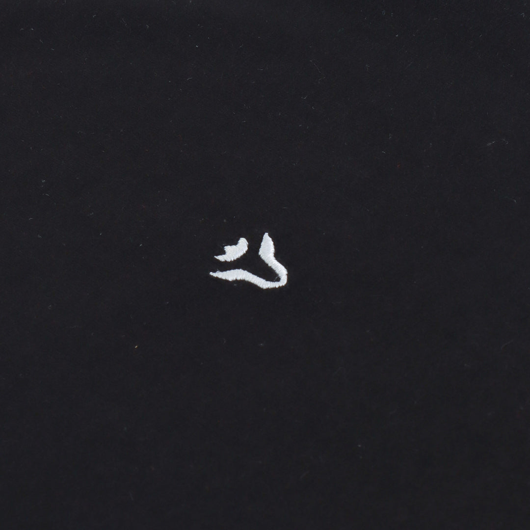 Close-up detail of Dare Wolf black round neck t-shirt collar