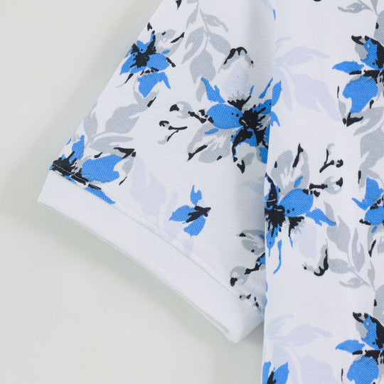 Close-up detail of Dare Wolf white blue floral polo t-shirt fabric texture