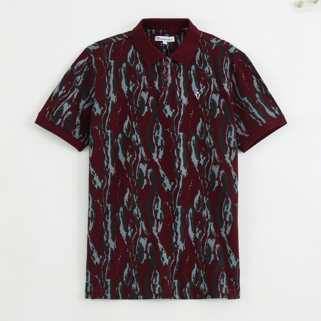 Detail view of maroon abstract print polo t-shirt fabric