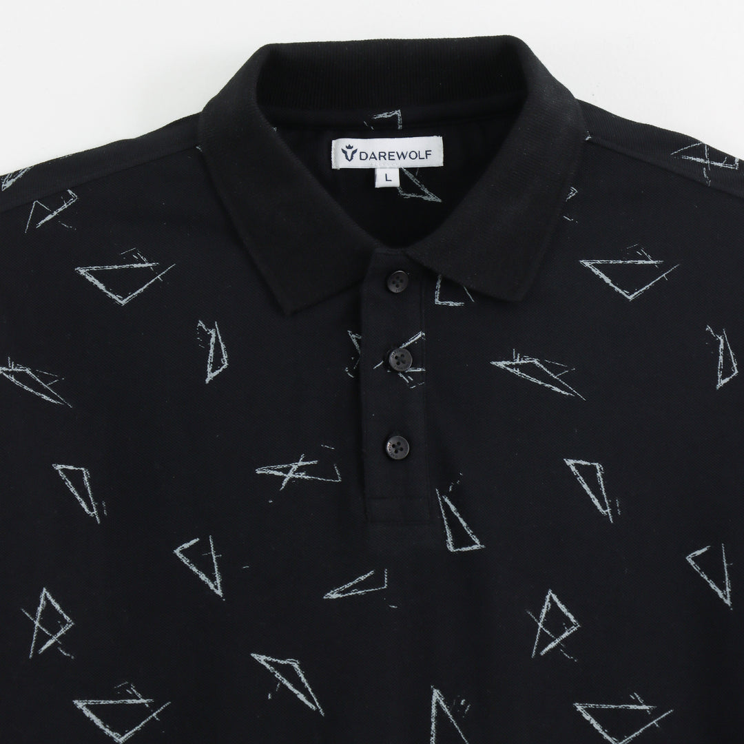 Close-up detail of Dare Wolf black geometric polo t-shirt sleeve