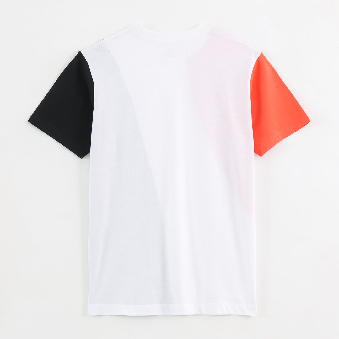 Close-up detail of Dare Wolf orange diagonal round neck t-shirt sleeve