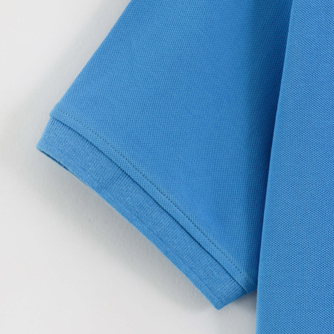 Close-up detail of Dare Wolf blue polo t-shirt button placket