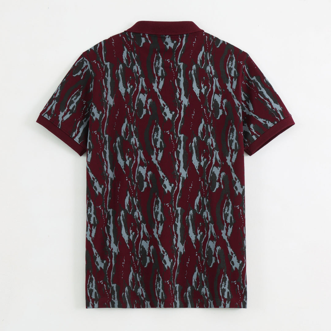 Close-up detail of Dare Wolf maroon abstract polo t-shirt collar