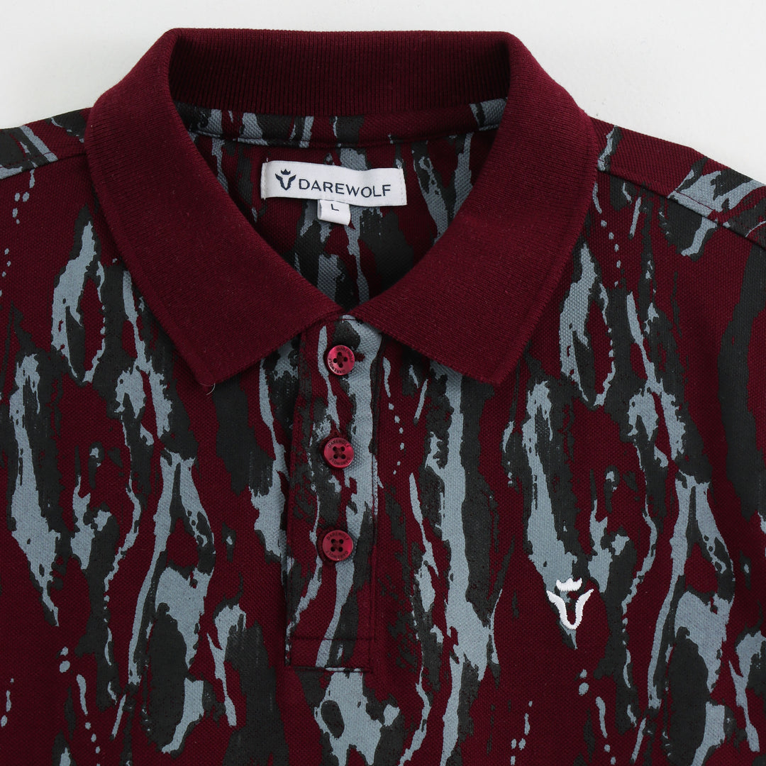 Close-up detail of Dare Wolf maroon abstract polo t-shirt sleeve