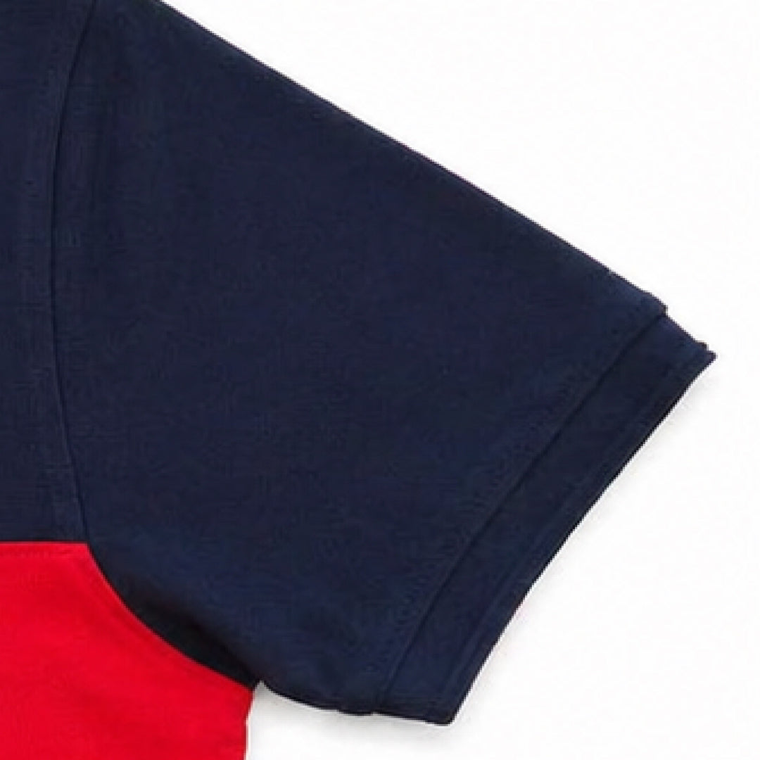 Close-up of sleeve detail on black and red cut & sew polo t-shirt