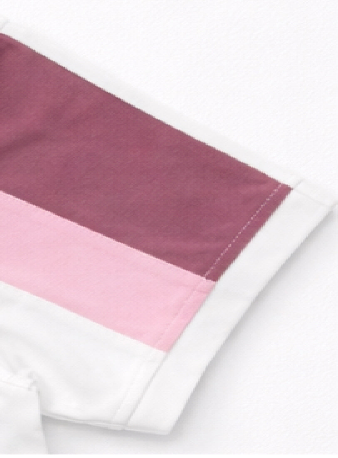 Close-up of sleeve detail on Dare Wolf cut & sew polo t-shirt